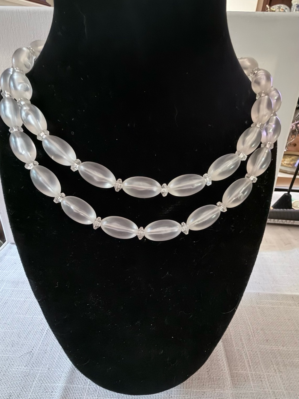 vintage statement necklace composed of smooth, oval-shaped translucent frosted